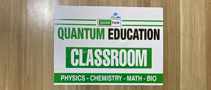 Quantum Education classroom signboard for physics, chemistry, mathematics and biology coaching.